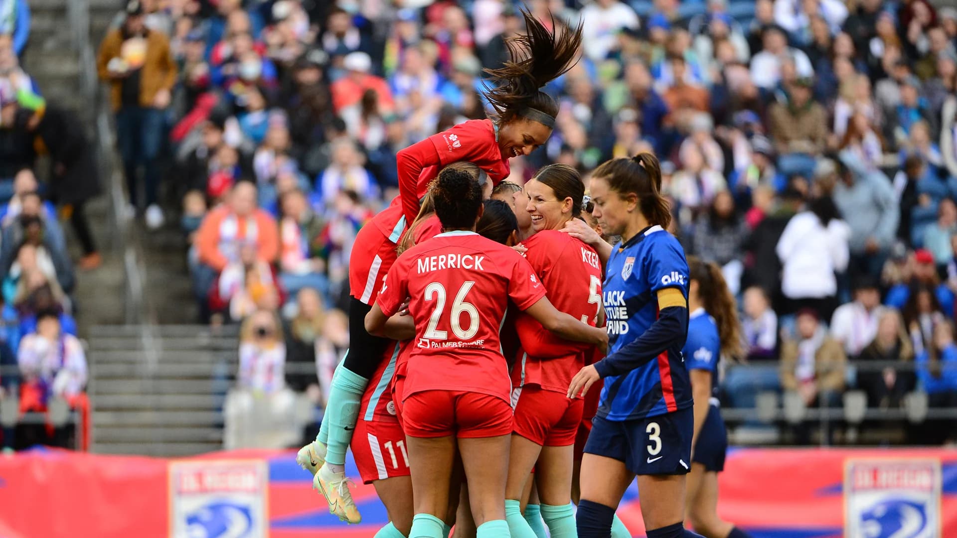 kansas-city-current-players-celebrate-goal-against-ol-reign