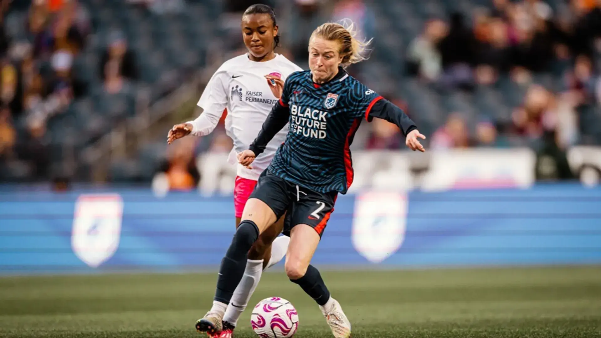 ol-reign-defender-emily-sonnett-dribbles