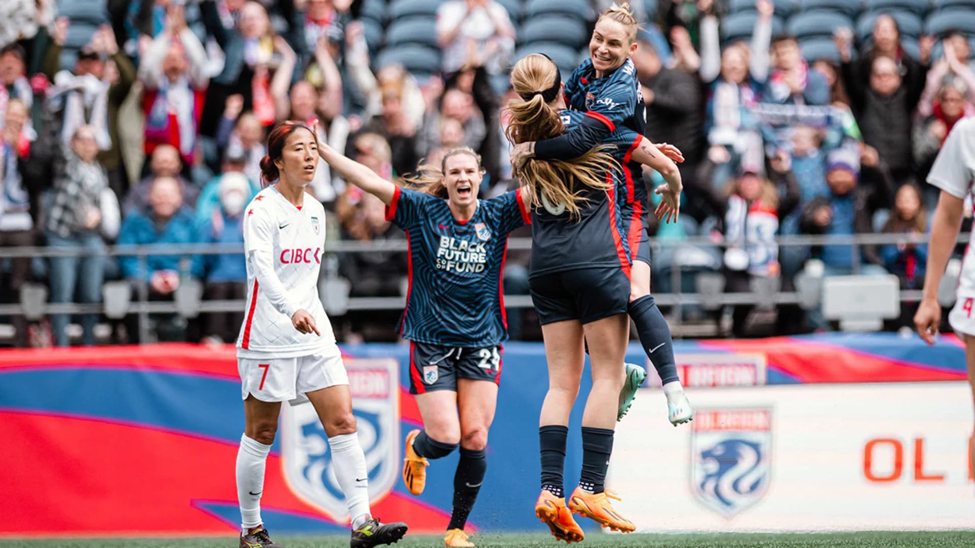 reign-players-celebrate-a-goal-against-chicago