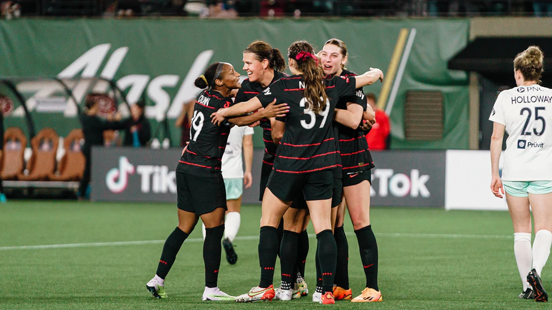portland-players-celebrate-a-goal-against-louisville